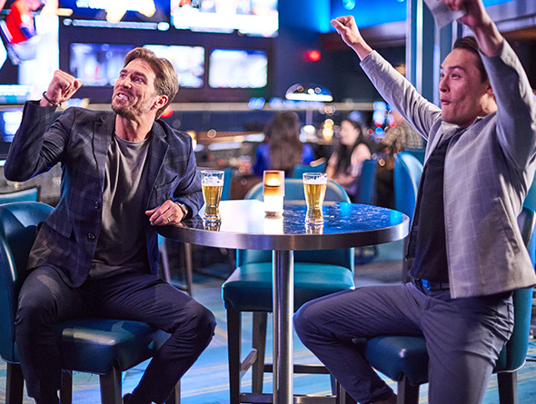 two guys cheering for a game in a Boyd sports book